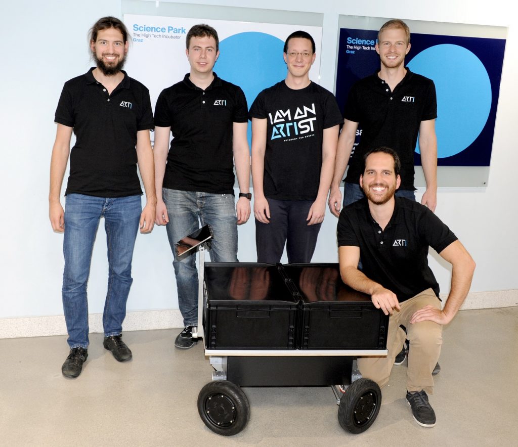 The founding team of robotic start-up ARTI with the very first robotic platform prototype.