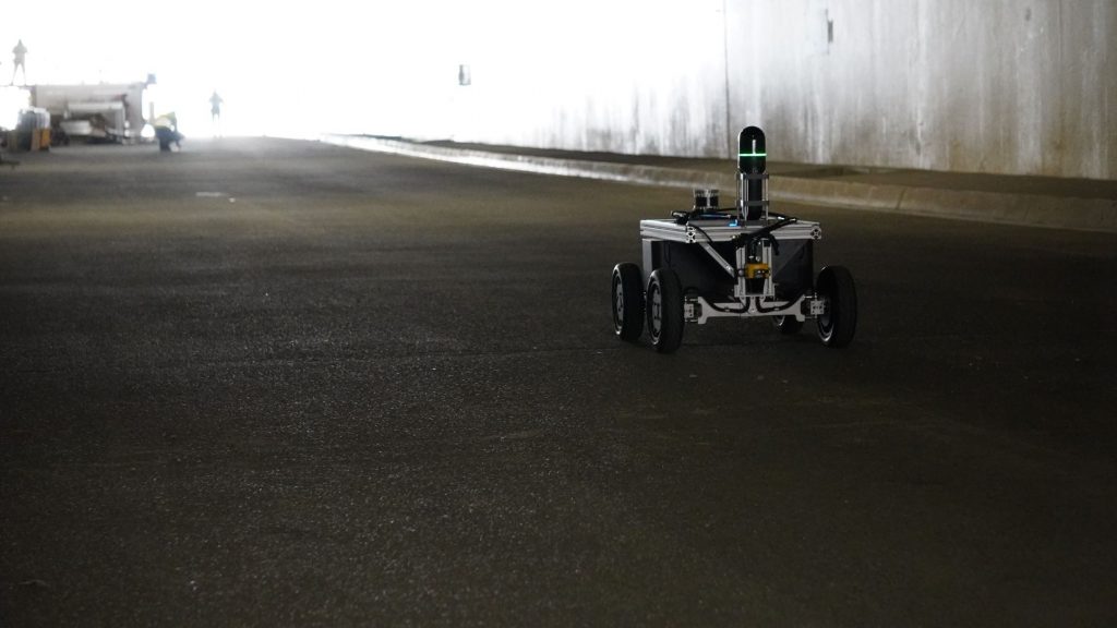Equipped robot drives through tunnel