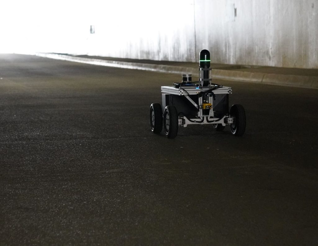 Equipped robot drives through tunnel