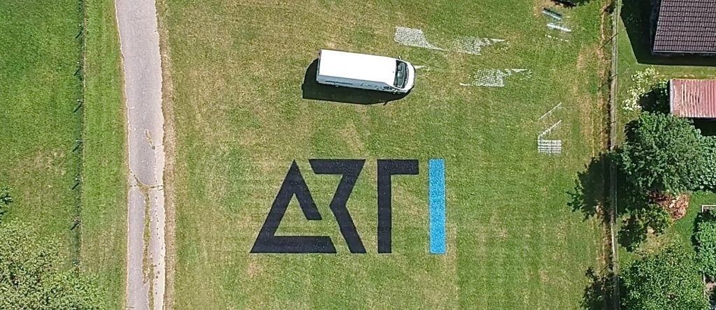 Large ARTI logo printed by Pixelrunner with autonomous outdoor robots.
