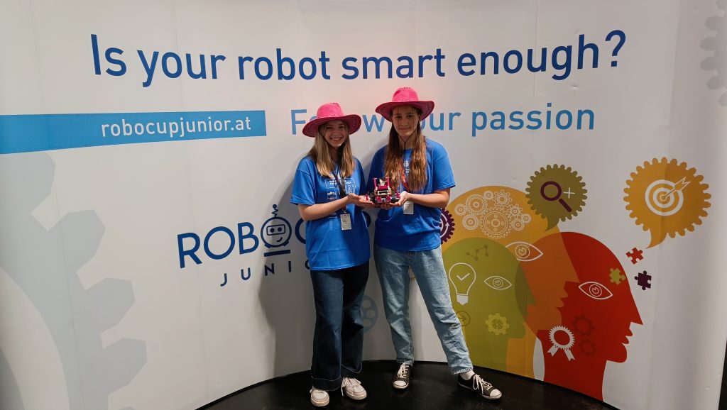 Two girls participating in the RoboCup Junior competition